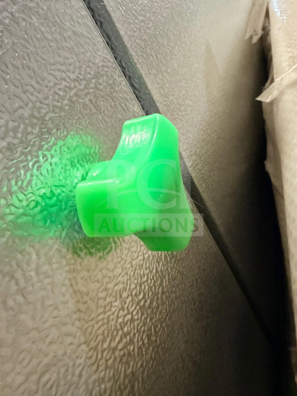 Continental DL48-82 commercial cooler door detail, green handle, textured surface. Model: DL48-82, SN: 1601006. New condition.