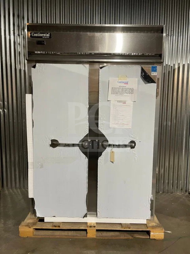 NEW Continental Commercial stainless steel 2-door reach-in refrigerator, model 2RN. Includes poly-coated wire rack, door locks with keys, 115V 1 phase, and casters. Serial number 16223951.