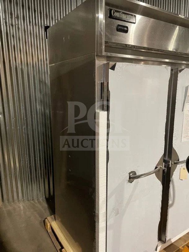 Continental 2-door stainless steel reach-in refrigerator, model 2RN, with poly coated wire rack, door locks, keys, and casters.