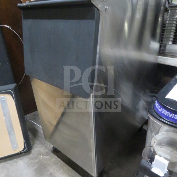 New Hoshizaki Ice Bin, 23x33x45.5 inches. Stainless steel, excellent condition, suitable for commercial use.