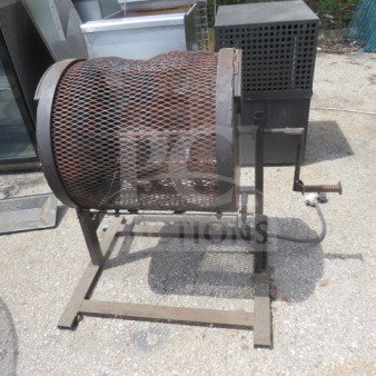 Propane powered chili roaster, 28x25x32 inches, metal mesh drum, hand crank, used condition, suitable for outdoor use.