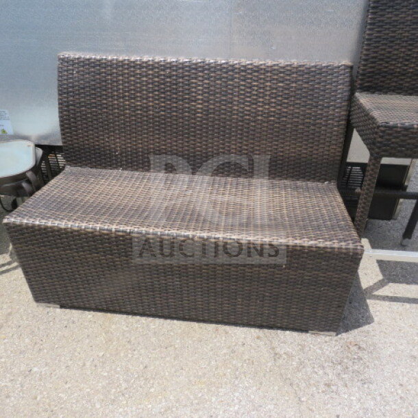 One Wicker Single Sided Booth, dark brown woven wicker, rectangular design, outdoor use, good condition.