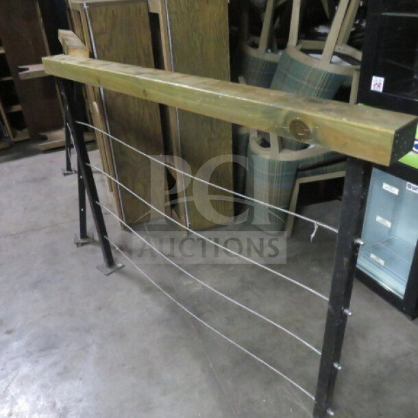 Wood and metal railing, 62x4x43 inches, featuring a wooden top and metal cables, in fair condition.