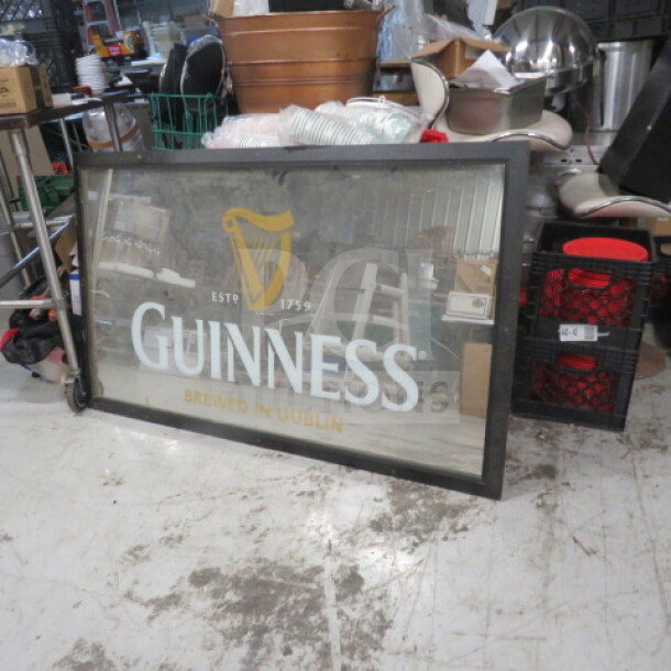 Framed Guinness mirror by Prosocoustic, 60x36 inches. Features Guinness logo and "Brewed in Dublin" text. Good condition.