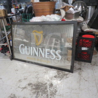 Framed Guinness mirror by Prosocoustic, 60x36 inches. Features Guinness logo and "Brewed in Dublin" text. Good condition.