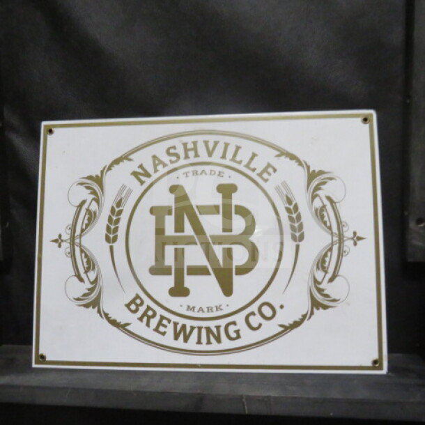 Nashville Brewing Co. tin sign, 16x12 inches, vintage style with logo and decorative border in good condition.