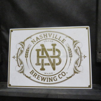 Nashville Brewing Co. tin sign, 16x12 inches, vintage style with logo and decorative border in good condition.