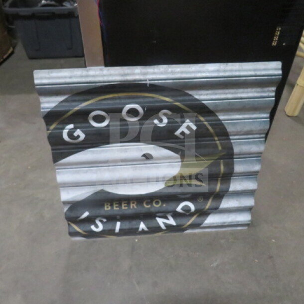 Goose Island tin sign, 23.5"x22.5", corrugated metal, features Goose Island logo. Good condition.