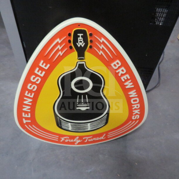 Tennessee Brew Works tin sign, 22.5x23.5 inches, featuring guitar design and vibrant colors. Excellent condition.