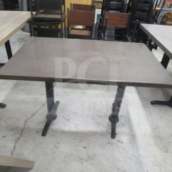 Laminate indoor/outdoor table with dual pedestal base, 48x30x30 inches. Brown finish, suitable for versatile use.