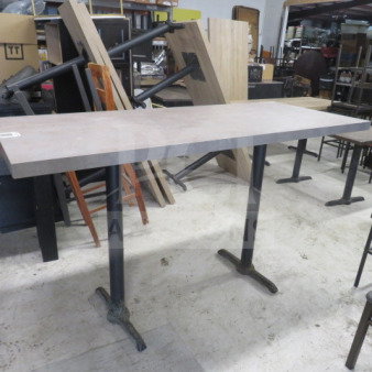 Gray wooden tabletop on dual bar-height pedestal bases, 48x30x42 inches, excellent condition, sturdy for commercial use.