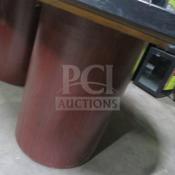 Two-piece table with three cylindrical pedestal bases, wood finish, dimensions 120"x48"x30", in good condition.