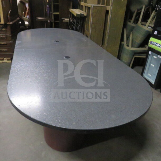 Two-piece table with three pedestal bases, dimensions 120x48x30 inches. Dark gray top, good condition, ideal for meetings.