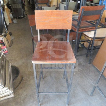 Black metal bar height chair with brown wooden seat and back, used condition. Simple, industrial design.