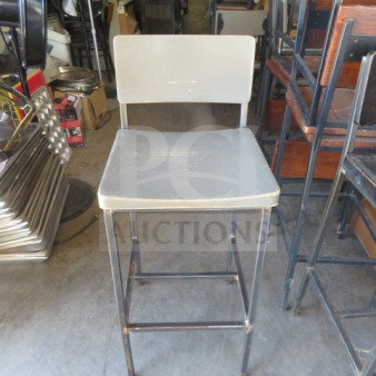 Black metal bar height chair with gray wooden seat and back. Visible use wear; sturdy construction. Model: 2XBID.