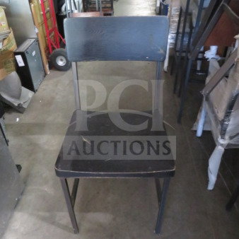Black metal chair with black wooden seat and back, slightly worn condition. Model: 2XBID.