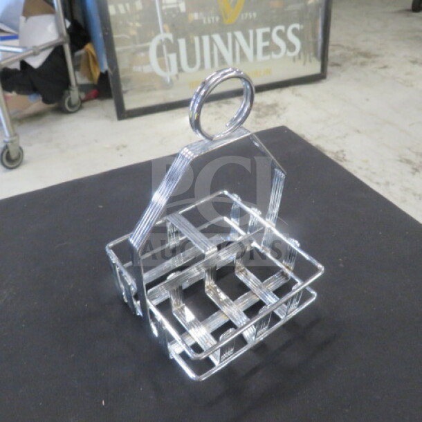 Set of 18 stainless steel tabletop condiment holders with integrated handle, brand new condition, grid design.