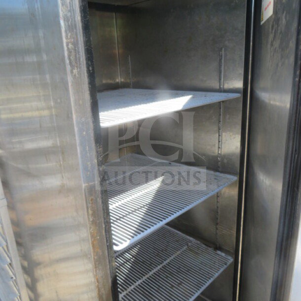 One Atosa 1 Door Freezer, model MBF8001-GR, with 3 racks, 115 volt, 28.5x32x82 inches, stainless steel interior.
