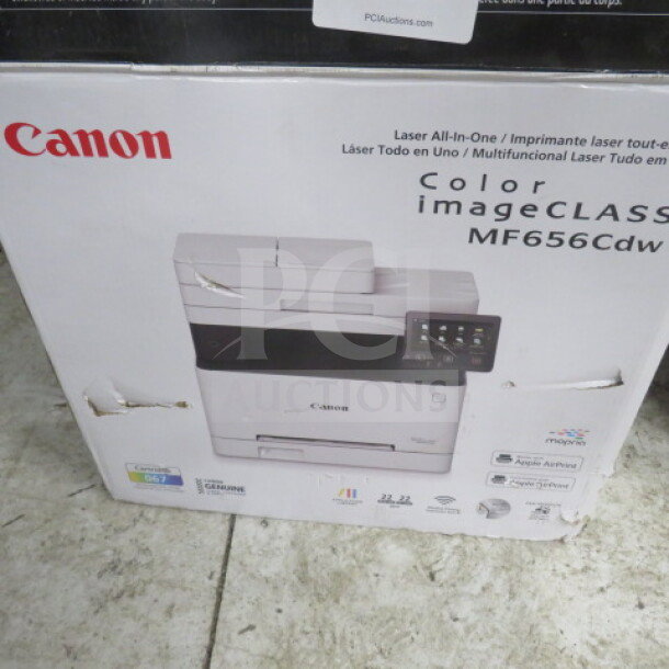 Canon MF656Cdw All-In-One Laser Printer in original packaging. Features multifunction capabilities. Slight box wear visible.
