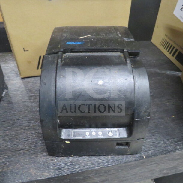 SNBC BTP M300 thermal printer, black, used condition, visible scuffs, control panel with buttons, ideal for high-volume printing.