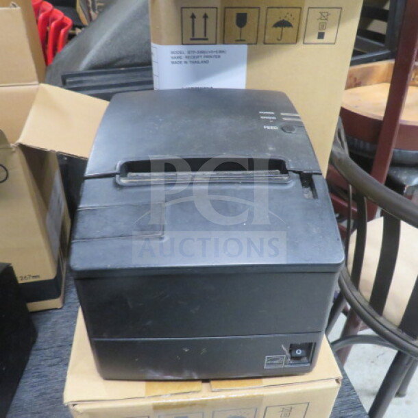 SNBC BTP-R180II thermal printer, black, in used condition, showing power and feed buttons. No visible wear or damage.