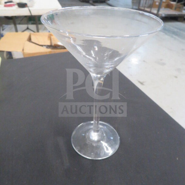 Belvedere Martini Glass, clear glass, classic V-shape, excellent condition, stands on a sturdy base.