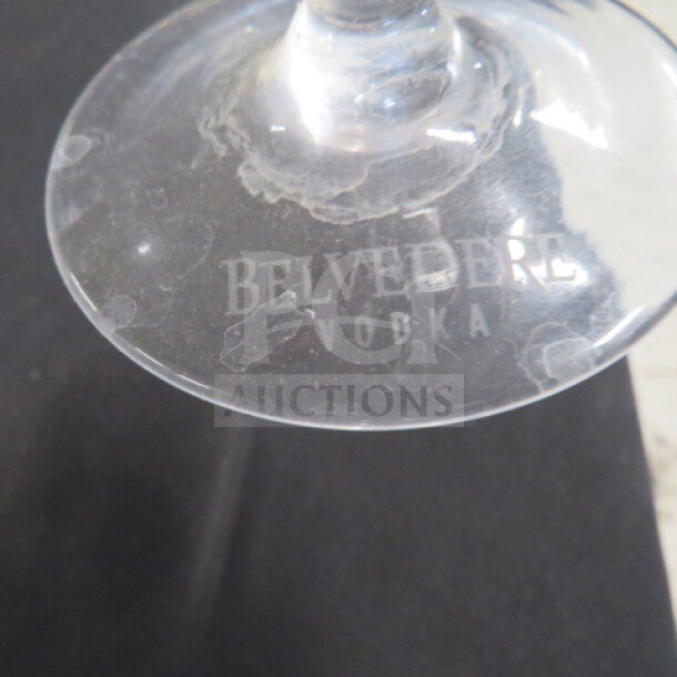 Belvedere Martini Glass with etched "Belvedere Vodka" logo, slightly worn condition, clear glass, item code 5XBID.
