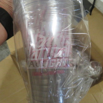 Clear Natural Lite cup in plastic wrapping, showing the logo and brand text. Cups appear unused and in original packaging.