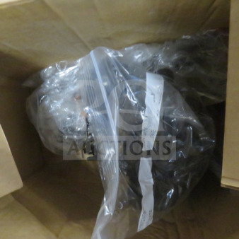 Cardboard box containing assorted miscellaneous items in clear plastic bags. Items are unorganized, condition unknown.