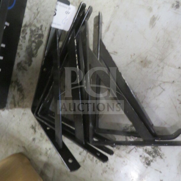 Black metal bracket lot, model 6XBID, in good condition. Features include pre-drilled holes and sturdy construction.