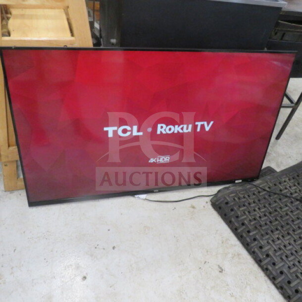 TCL 55S525 55-inch flatscreen TV, displaying TCL Roku TV interface. Model: 55S525. In working condition, 4K HDR feature.