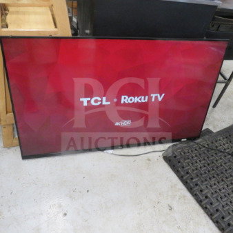 TCL 55S525 55-inch flatscreen TV, displaying TCL Roku TV interface. Model: 55S525. In working condition, 4K HDR feature.