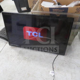 42-inch TCL flatscreen TV, model #42S, in working condition. Display shows TCL logo. Includes power cord.