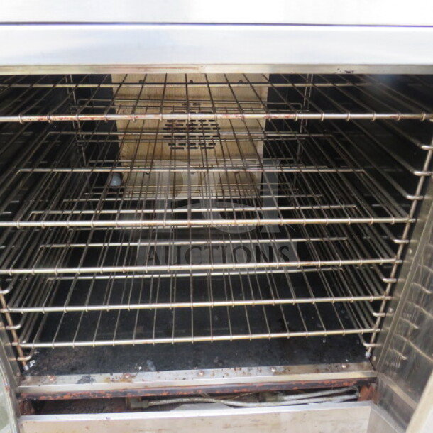 American Range double stack convection oven, Model M-2-G1, natural gas, 10 racks, stainless steel interior, pre-owned.