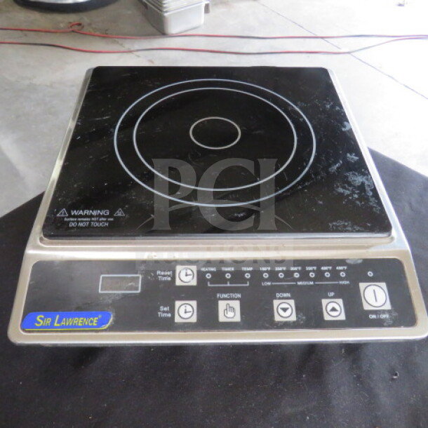 Sir Lawrence induction range, 120 volts, touch controls, functions labeled, working condition, sturdy design.