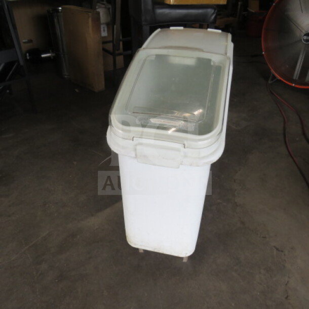 Rubbermaid ingredient bin model 3600 on casters, used condition. Clear lid with latch.