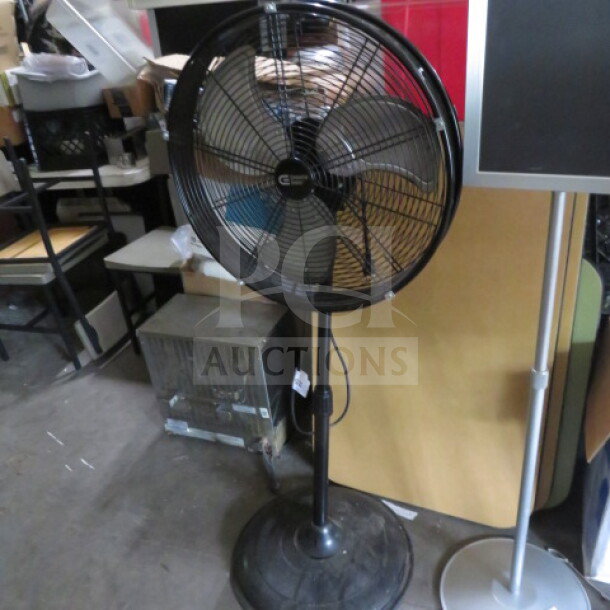 Rubbermaid 3600 commercial stand fan, model SFSD1-500BIW, black, used condition, visible wiring and adjustable height.