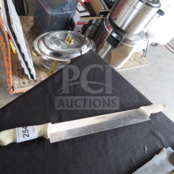 One Dexter Double Handle Knife, stainless steel blade, white handles, good condition, with auction tag visible.