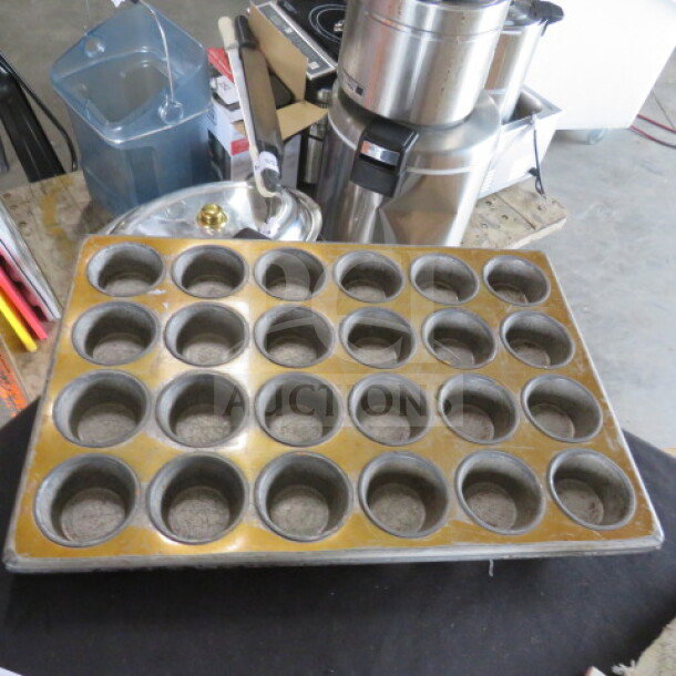 Chicago Metallic 24 Hole Muffin Pan, model 3320. Commercial-grade, light wear, suitable for high-volume baking.