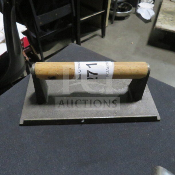 Heavy-duty steak weight with wooden handle and metal base, item number 271 visible. Good condition for grilling use.