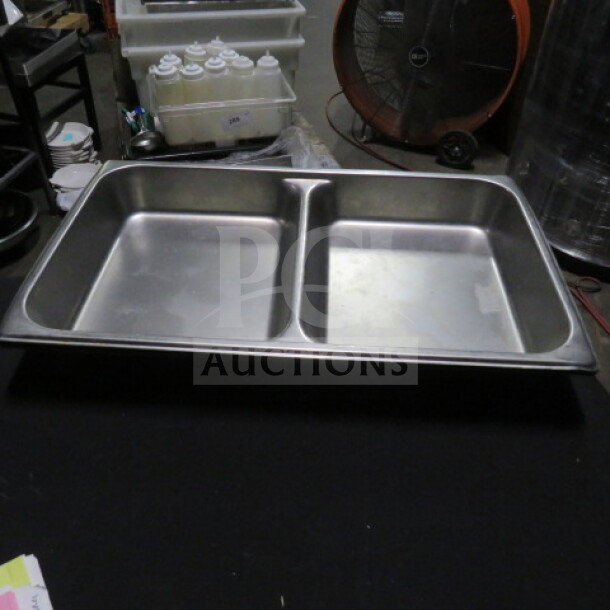 Stainless steel full-size 2.5-inch deep divided hotel pan, used condition, perfect for buffet or catering use.