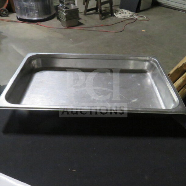 Full-size 2.5-inch deep hotel pan, stainless steel, minor surface wear, ideal for commercial kitchen use.