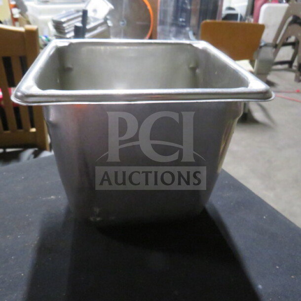 1/6 size, 6-inch deep stainless steel hotel pan in good condition. Suitable for commercial kitchen use.