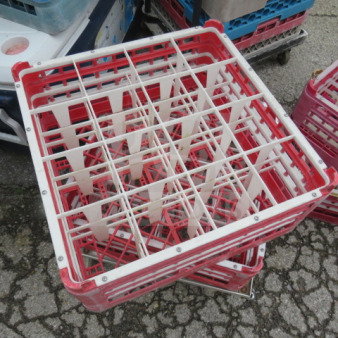 Red and white 16-hole dishwasher rack, model 2XBID, in used condition, featuring a grid design for secure placement.