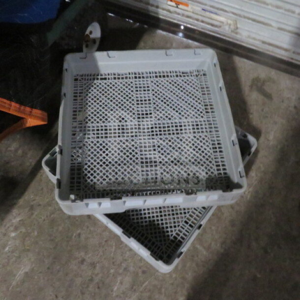 Flatware dishwasher rack in good condition, model 2XBID, features a durable mesh design for efficient cleaning.