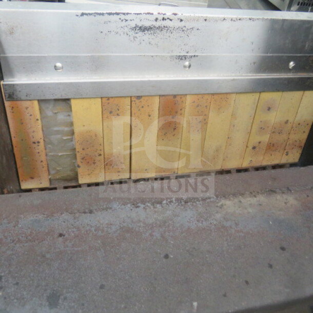Rotisol rotisserie, model 38X20X45. Stainless steel, used condition with visible wear. Ideal for commercial use.