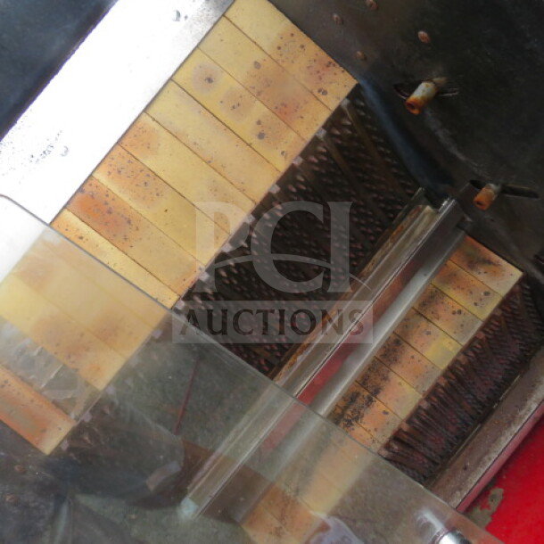 Rotisol rotisserie, 38x20x45 inches, stainless steel with visible cooking elements, in used condition.