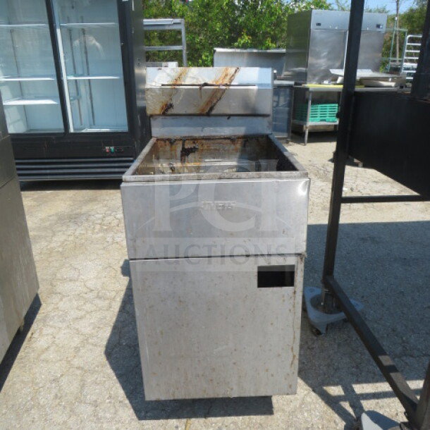 Anets SLG100 70lb natural gas deep fryer, stainless steel, 19.5x31x46.5 inches, used condition, visible grease stains.