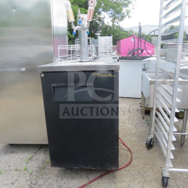 True TDD-1 kegerator with 1 tower and 3 taps, on casters. Dimensions 23.5x29.5x38.5 in. 115V. Good condition.
