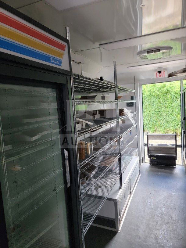 2021 SDG 8.5' x 20' mobile trailer interior, featuring True merchandisers, wire shelves, and POS workstation.